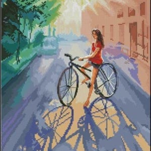 Girl on bicycle cross stitch pattern