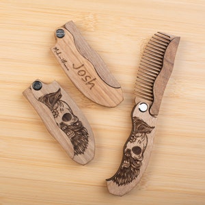 May include: Three wooden pocket combs with a skull and beard design. One comb is engraved with the name "Josh" and the text "Made in Ukraine".