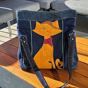 Bolso de mano en jeans reciclado y corcho, piel ecológica.