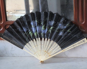 Antique fan with bone rods and the country of black tulle with hand-painted details.