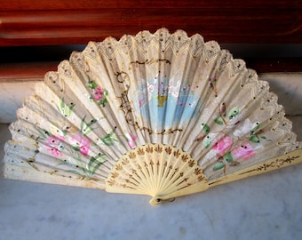 Antique fan with bone rods and white country with hand-painted details and sequins