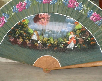 Vintage fan made of wood and painted by hand, for many uses.