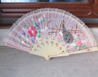 Vintage fan of hand-painted tulle. Fan wooden rods