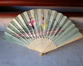 Vintage fan of green tulle painted by hand. Bone rods.