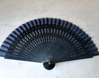 Vintage navy blue fan. Wooden rib fan