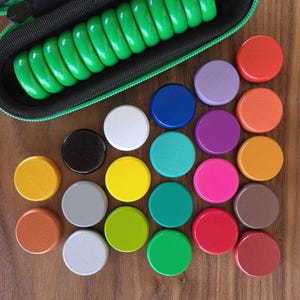 Discos de crokinole con estuche rígido de transporte