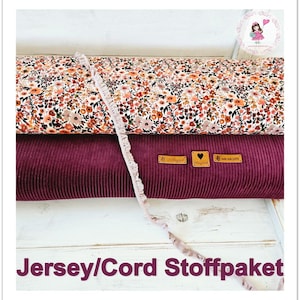 Könnte beinhalten: Ein Stoffpaket mit einem Jersey-Stoff mit Blumenmuster und einem burgunderfarbenen Cordstoff. Der Stoff ist gefaltet und auf einer weißen Oberfläche präsentiert. Der Text "Jersey/Cord Stoffpaket" ist unten im Bild sichtbar.