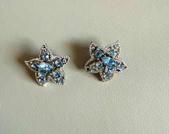 Vintage 1967 Sarah Coventry "Star Fire" Clip Earrings | Silver Tone Blue Rhinestone Starburst Earrings | Mid-Century Atomic Jewelry