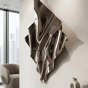 May include: A large, wall-mounted sculpture made of polished, reflective dark metal with an irregular, fluid, and rippled surface that creates distorted reflections of the surrounding room and light sources.