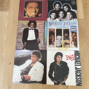 May include: A collection of six Michael Jackson and The Jacksons vinyl record covers. Titles include One Day In Your Life, Triumph, Off The Wall, Farewell My Summer Love, Thriller, and Bad. Each cover features photographic portraits of the artist.