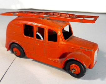 Dinky no. 250 Fire Engine. Good paint. Ladder intact. Black wheels. Made 1957