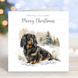 Carte de Noël teckel (poil long noir et feu), carte de voeux de chien « Joyeux Noël », scène d'hiver festive, 6 x 6 po