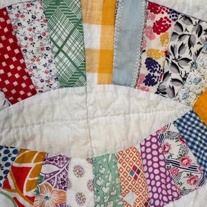 May include: A white ceramic mug with a black handle and the text "But First, Coffee" in a handwritten style. The mug is on a white surface. The mug is approximately 4 inches tall.