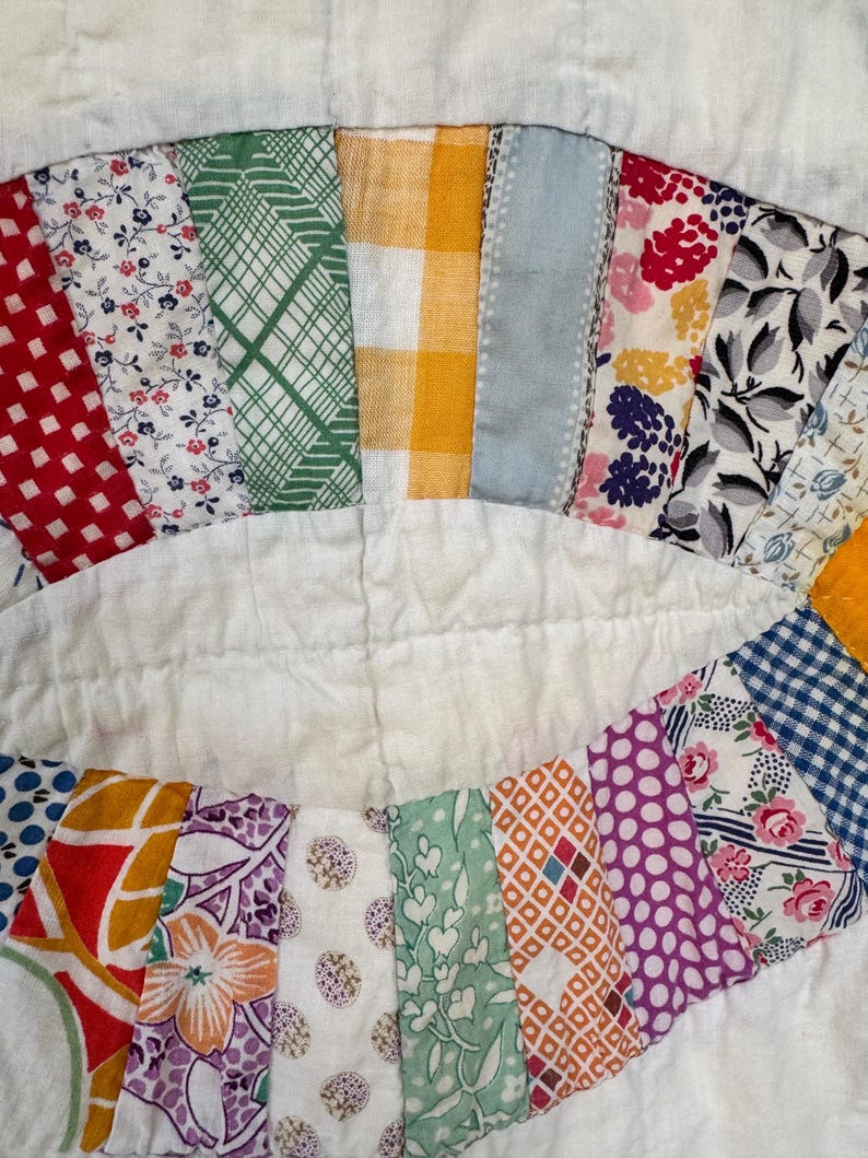 May include: A white ceramic mug with a black handle and the text "But First, Coffee" in a handwritten style. The mug is on a white surface. The mug is approximately 4 inches tall.