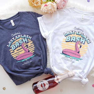 May include: Two t-shirts with a flamingo pool float graphic and the text "Custom's Last Splash Bash" in a retro font. The shirts are in navy blue and white. The text also includes the location "Las Vegas" and the date "September 23, 2023".