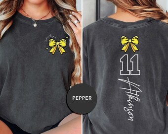 Custom Softball Mom Shirt – “Tied to the Game” Bow Tee | Personalized Name & Number Back | Softball Game Day Shirt