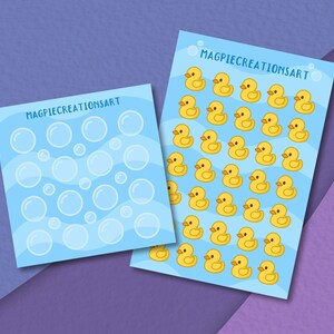 May include: Two sheets of blue paper with white outlines of bubbles and yellow rubber duckies. The top sheet has the text "MAGPIECREATIONSART" and the bottom sheet has the text "MAGPIECREATIONSART".