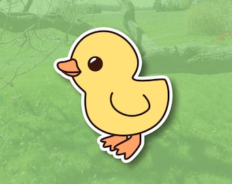 May include: A cartoon illustration of a yellow chick with large eyes and a small beak. The chick is standing on a green grassy field.