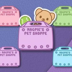 May include: Five colorful cartoon-style boxes with the text "O MAGPIE'S O PET SHOPPE" on each. The boxes are arranged in a semi-circle with a teddy bear sticker and a tennis ball sticker on top of one of the boxes.