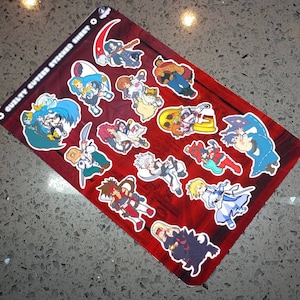 May include: A sticker sheet featuring various anime-style character illustrations. The stickers are on a red background with a white border. The text "GUILTY CUTTER STICKED SHEET" is printed on the top left corner.