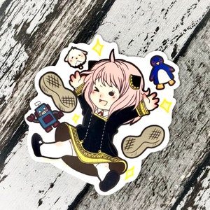 Puede incluir: Una pegatina con un personaje de dibujos animados con pelo rosa, vestido con un vestido negro con adornos dorados y calcetines blancos. La pegatina incluye un perro pequeño, un pingüino azul, un robot y dos cacahuetes.