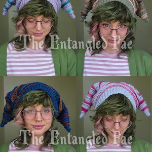 May include: Four colorful, crocheted hats with pointed tips are displayed. Each hat features a unique color scheme, including purple, green, blue, and light blue with pink stripes. The hats are worn by a person with green hair and glasses. The text "The Entangled Fae" is visible.
