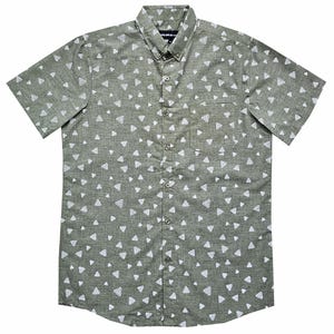 May include: A green short-sleeved button-down shirt with a white triangle pattern. The shirt has a pocket on the left side.