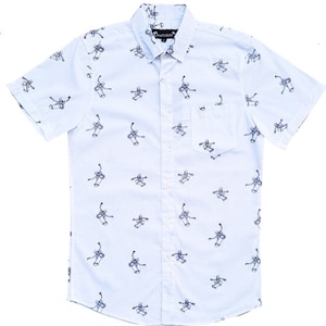 May include: A white short-sleeved button-down shirt with a repeating pattern of a person skateboarding. The shirt has a small pocket on the left side and the brand name "MATSURU" is printed on the collar.