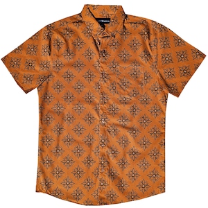 May include: A short-sleeved button-down shirt with a brown background and a black geometric pattern. The shirt has a pocket on the left side.