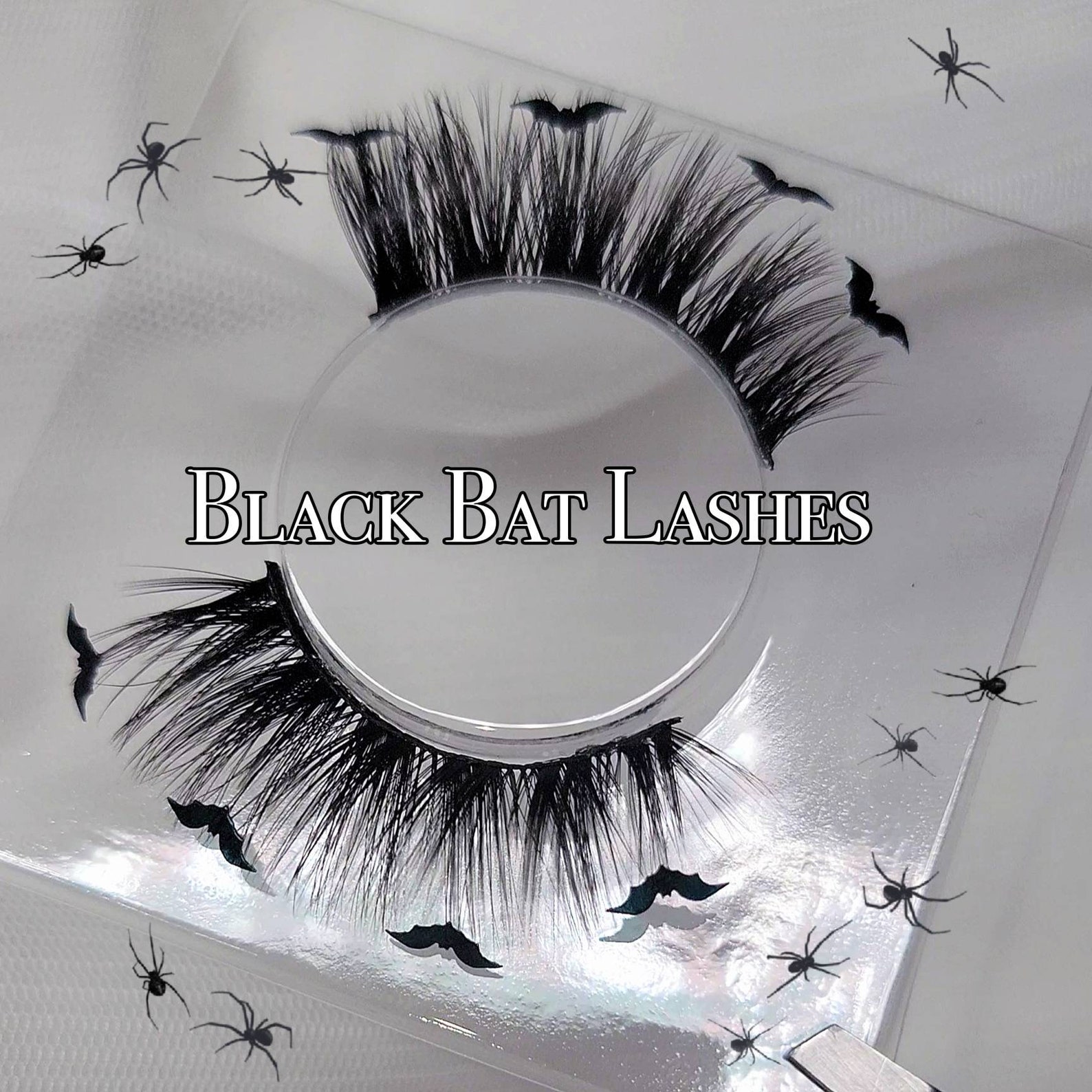 Black bat-themed dramatic false eyelashes with fluffy volume, perfect for gothic lashes and spooky goth eye makeup looks.