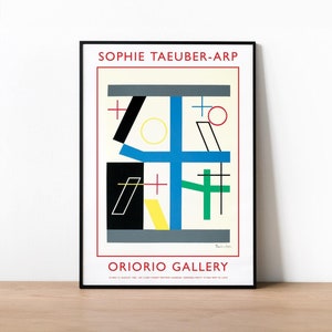 Puede incluir: Lámina artística enmarcada con un diseño abstracto colorido. Presenta formas geométricas en negro, azul, verde, amarillo y rojo. La impresión incluye el texto "SOPHIE TAEUBER-ARP" y "ORIORIO GALLERY" en un marco negro.