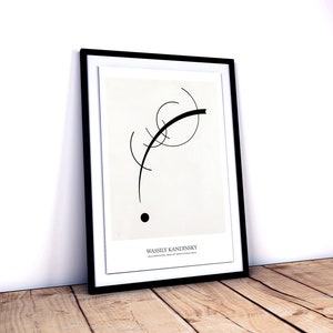 May include: Black and white abstract art print in a black frame. The print features a curved line and a circle. The artist's name, Wassily Kandinsky, is printed at the bottom of the print.