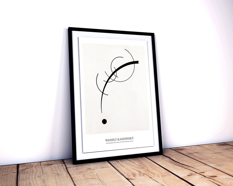 May include: Black and white abstract art print in a black frame. The print features a curved line and a circle. The artist's name, Wassily Kandinsky, is printed at the bottom of the print.