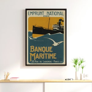 May include: A vintage poster advertising Banque Maritime, a French bank, with the text "Emprunt National 1920" and "Banque Maritime 28 Rue de Laborde - Paris (VIII)" in a black frame. The poster features a black and white illustration of a ship sailing on a blue sea with a seagull flying overhead.
