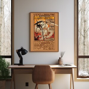 May include: A vintage poster advertising a French edition of H.G. Wells's "The War of the Worlds." The poster features an illustration of a Martian tripod attacking a city, with flames and smoke in the background. The text on the poster reads "VIENT DE PARAITRE H.G. WELLS LA GUERRE DES MONDES ILLUSTREE PAR ALVIM CORREA UN VOLUME in 4 de GRAND LUXE. edite par L.VANDAMME & C&deg; EDITION UNIQUE a 500 EXEMPL. NUMEROTES - 100 Illustrations dans le texte - 32 PLANCHES hors texte sur onglels Prix: 60 Frs."