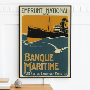 May include: A vintage poster advertising Banque Maritime, a French bank, with the text "Emprunt National 1920" and "Banque Maritime 28 Rue de Laborde - Paris (VIII)". The poster features a black and white illustration of a ship sailing on a blue sea with a seagull flying overhead.