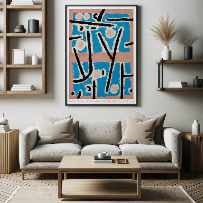 May include: A framed abstract art print with black lines and shapes on a blue and pink background. The print has the text "Paul Klee Paintings 1920-40" at the bottom.