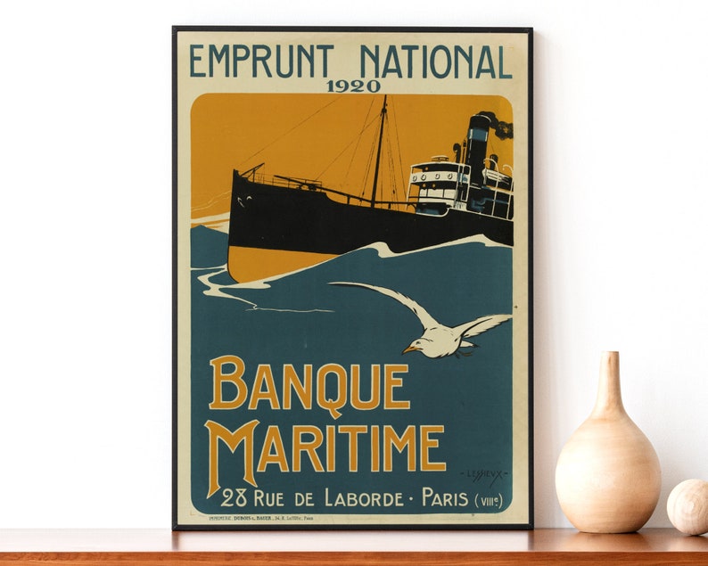 May include: A vintage poster advertising Banque Maritime, a French bank, with the text "Emprunt National 1920" and "Banque Maritime 28 Rue de Laborde - Paris (VIII)". The poster features a black and white illustration of a ship sailing on a blue sea with a white seagull flying overhead.
