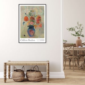May include: A poster featuring a painting of a blue vase filled with colorful flowers. The vase is on a light green background with a few small, light blue shapes. The text "Odilon Redon" is at the bottom left of the poster, and "The Lessing J. Rosenwald Collection" is at the bottom right.