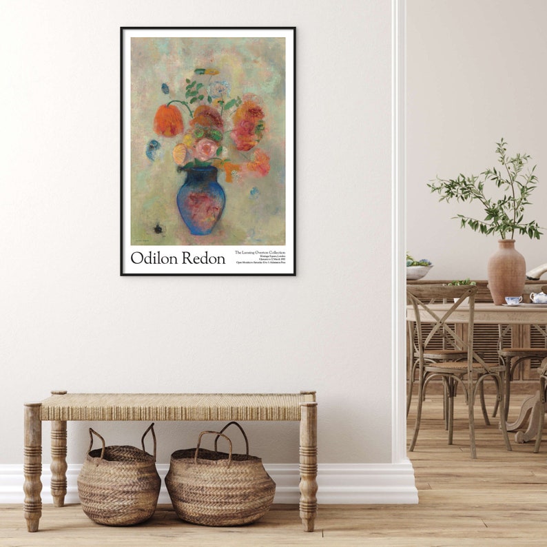 May include: A poster featuring a painting of a blue vase filled with colorful flowers. The vase is on a light green background with a few small, light blue shapes. The text "Odilon Redon" is at the bottom left of the poster, and "The Lessing J. Rosenwald Collection" is at the bottom right.