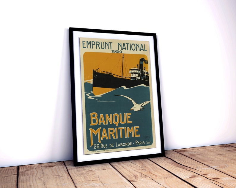 May include: A vintage poster advertising a 1920 national loan for the Banque Maritime. The poster features a black and white illustration of a ship sailing on a blue and yellow sea with a white seagull flying overhead. The text "Emprunt National 1920" is at the top of the poster, and the text "Banque Maritime 28 Rue de Laborde - Paris (VIII)" is at the bottom.
