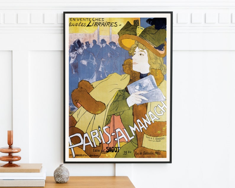 May include: A vintage poster advertising "Paris-Almanach" with a woman in a large hat and fur coat holding a book. The poster is in French and features a colorful illustration.