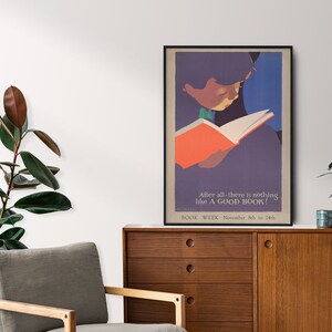 May include: A vintage poster with a colorful illustration of a person reading a book. The text on the poster reads "After all-there is nothing like A GOOD BOOK! BOOK WEEK November 8th to 14th."