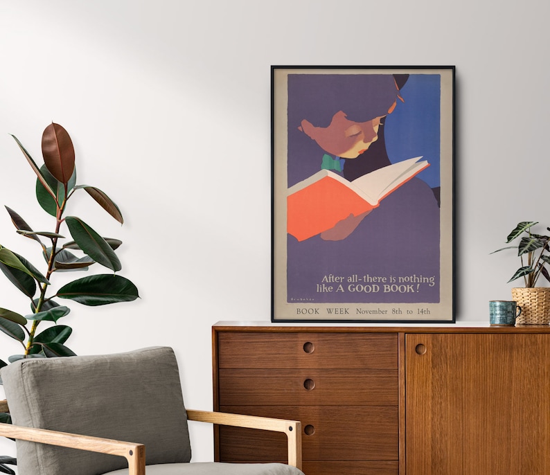 May include: A vintage poster with a colorful illustration of a person reading a book. The text on the poster reads "After all-there is nothing like A GOOD BOOK! BOOK WEEK November 8th to 14th."