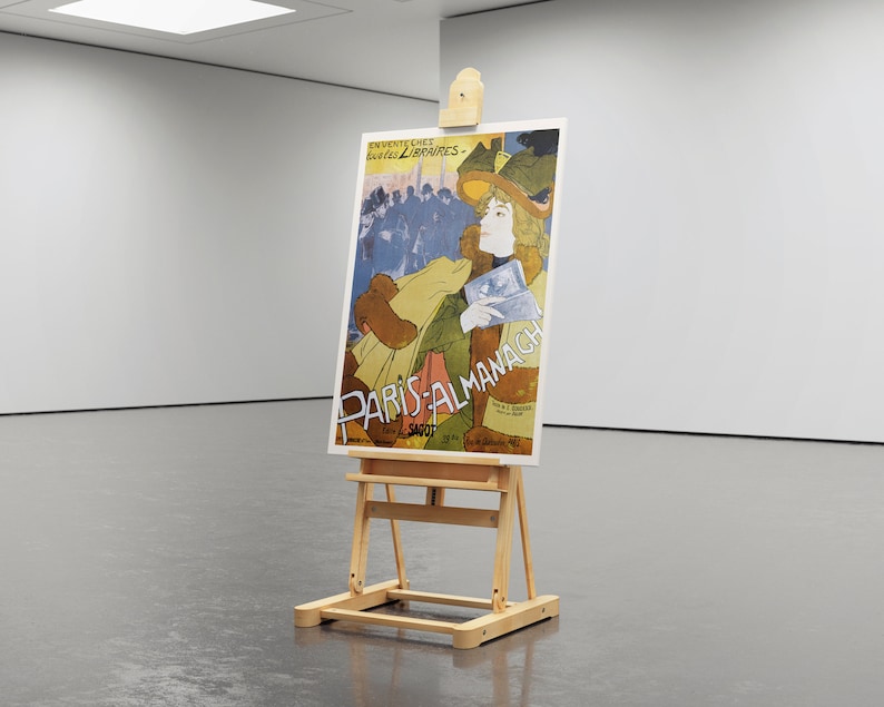 May include: A vintage poster on an easel advertising "Paris-Almanach" with a woman in a hat and a colorful background.