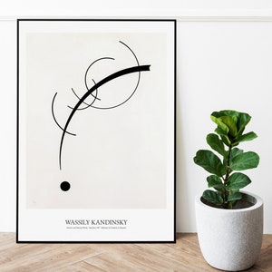 May include: Black and white abstract art print featuring a black line and a black circle on a white background. The print is framed in a black frame and has the text "Wassily Kandinsky" at the bottom.