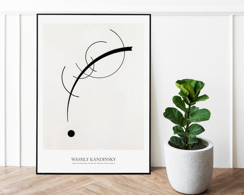 May include: Black and white abstract art print featuring a black line and a black circle on a white background. The print is framed in a black frame and has the text "Wassily Kandinsky" at the bottom.