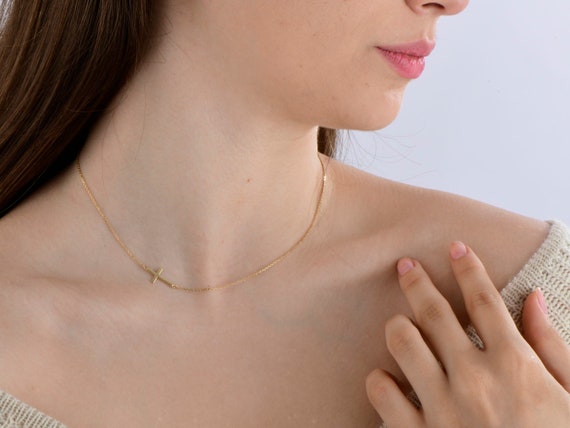 Tiny sideways clearance cross necklace