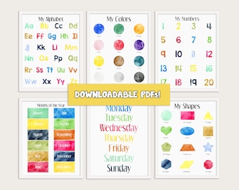 May include: Set of printable educational posters for children featuring colorful watercolor illustrations of the alphabet, numbers, colors, days of the week, months of the year, and shapes. The posters have a white background and are framed in white.