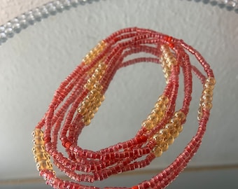 Waistbeads baya colore rosso e oro